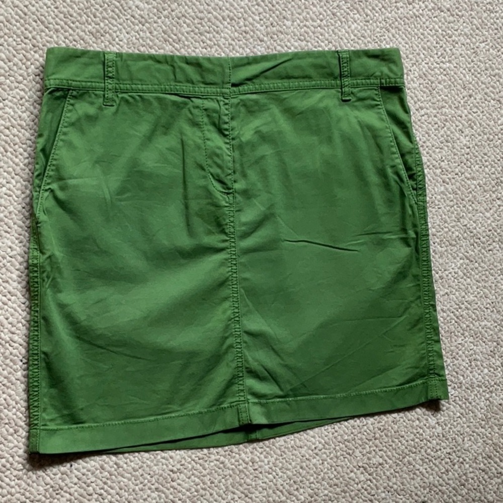 Green mini jeans style skirt
